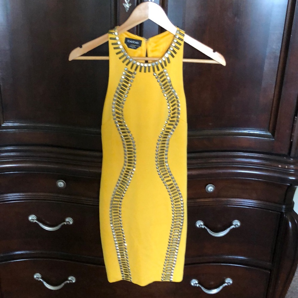 Bebe Halter Dress with Gold and Silver details.